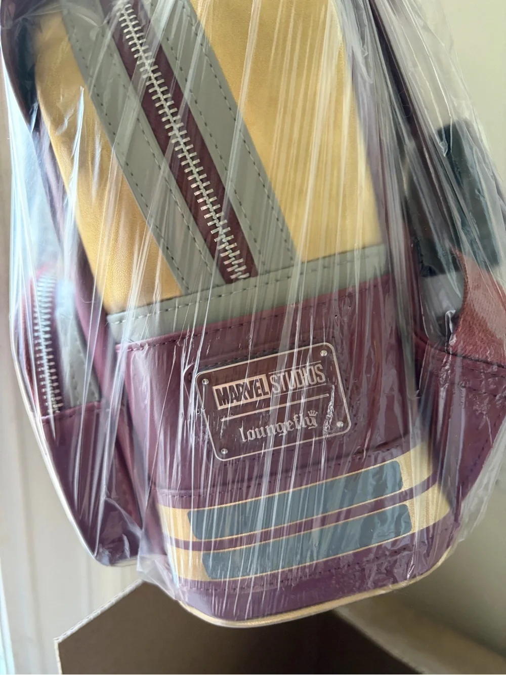Loungefly Gold and Burgundy Dare Devil Mini Backpack